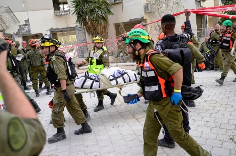 rescue-workers-carry-the-body-of-a-victim-from-a-residential-building-destroyed-by-a-missile-strike-in-beersheba-israel-bernat-armangue-ap-photo_11zon-32cf4fcc57d05abc22b5fd17fed26ff91750820568.jpg